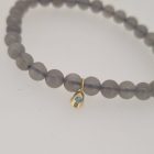 Armband Pura met maansteenkralen en geelgouden druppel bedel met blauwe diamant